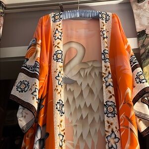 Kimono style cover up is made of rayon and 54 inches long